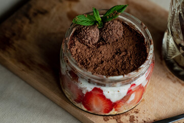frozen coffee in a faceted glass, tiramisu with strawberries