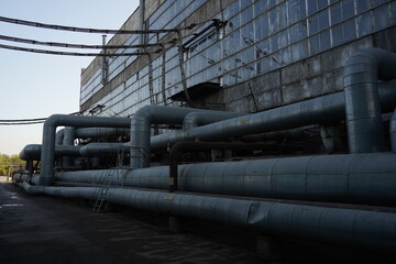 Almaty, Kazakhstan - 10.07.2022 : Large pipes on the territory of the heating plant and electrical substation.