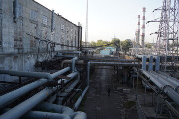 Almaty, Kazakhstan - 10.07.2022 : Large pipes on the territory of the heating plant and electrical substation.