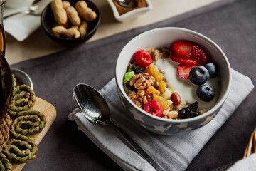 breakfast set, oatmeal with berries and yogurt, black tea with roses, bread