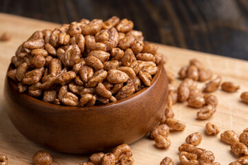 Grain wheat covered with a thin layer of chocolate