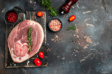 raw pork leg on a wooden board, Culinary cooking. banner, menu, recipe place for text, top view