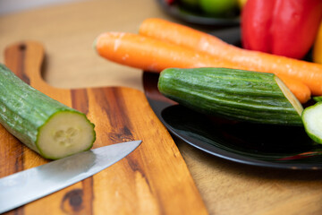 Sliced green cucumber lying on a cutting board