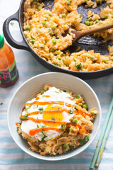 Kimchi fried rice with fried egg and sriracha