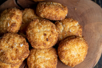 Delicious cookies with coconut on the table