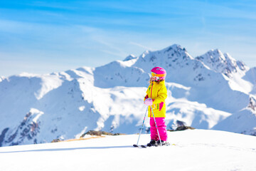 Fototapeta na wymiar Ski and snow fun. Kids skiing. Child winter sport.