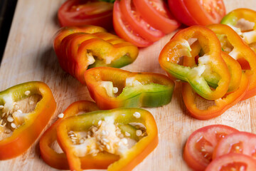 Fresh ripe bell pepper sliced on a board