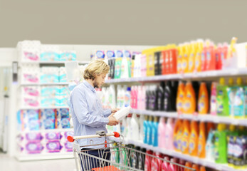 shopping in supermarket.(washing powder,detergent,shampoo,toilet paper, soap)