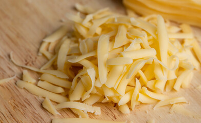 Sliced and grated hard cheese with cashew nuts