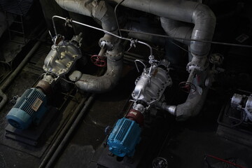 Fototapeta na wymiar Almaty, Kazakhstan - 10.07.2022 : Pipes, valves and pressure sensors in the generator room at the heating plant.