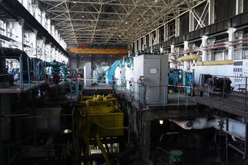 Fototapeta premium Almaty, Kazakhstan - 10.07.2022 : Pipes, valves and pressure sensors in the generator room at the heating plant.