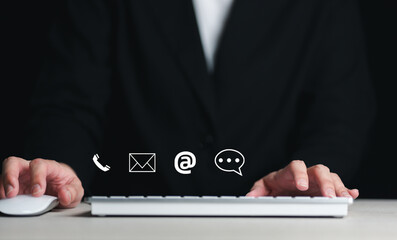 Website page contact us or e-mail marketing concept, Customer support hotline Contact us people connection. Label wood with the email, call phone, address, Chat message icons.