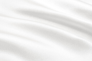 Texture of white satin or silk fabric with waves and rumples. white material