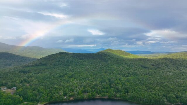 Aerial view of Rainbow over Stinson Lake in White Mountain National Forest in summer in town of Rumney, Grafton County, New Hampshire NH, USA. 