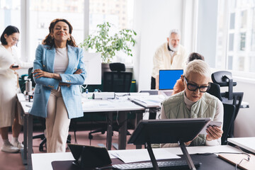 Busy multiracial colleagues working in office