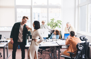 Group of diverse colleagues working in office