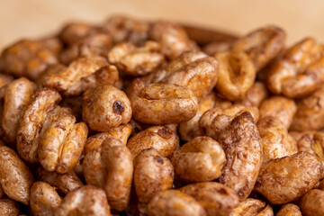 Grain wheat covered with a thin layer of chocolate