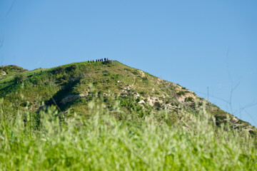 group of hikers summiting the ridge