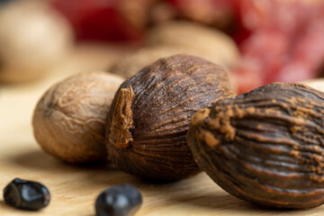 A whole nutmeg fruit on the kitchen table
