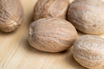 A whole nutmeg fruit on the kitchen table