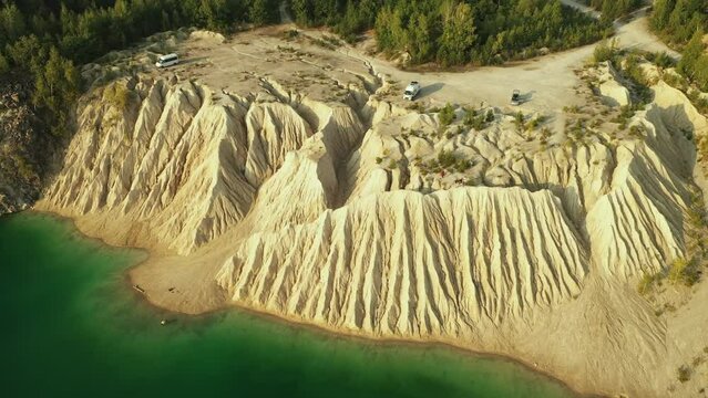A very beautiful lake among the hills, quartz mountains and the endless Ukrainian forest. Bright, sunny day. Druzhbovsky quarry, Zhytomyr region, Ukraine.
