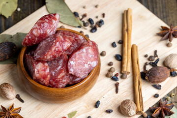 Dried veal sausage during slicing