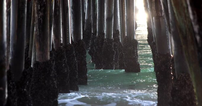 Crashing Waves Under A Pier