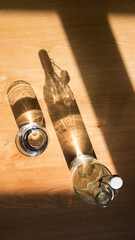 Obraz na płótnie Canvas Glass bottle with sun lights shadow