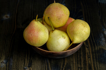 harvested sweet ripe pear in drops of water