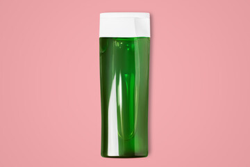 Cosmetic bottle with green gel. Shampoo, gel, cleanser. On a pink background