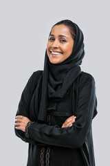 Naklejka na ściany i meble Beautiful middle eastern woman wearing abaya dress in Dubai. Young woman showing abaya and hijab fashion clothes in studio