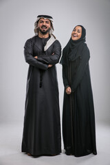 Arabic handsome man and woman studio portraits in Dubai