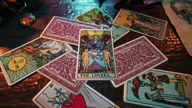 Madrid, Spain - January 11, 2020. Mystic divination on the romantic The Lovers tarot card. Mystic divination forecasting the future romantic success. Mystic divination foreseeing the romantic harmony