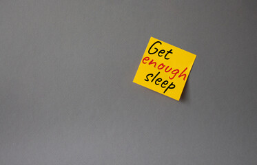 Get enough sleep symbol. Concept words Get enough sleep on orange steaky note. Beautiful grey background. Healthy lifestyle, medical and Get enough sleep concept. Copy space.