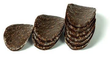 Dark chocolate chips on a white background