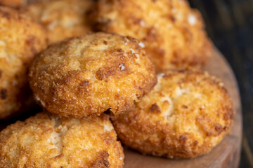 Delicious cookies with coconut on the table