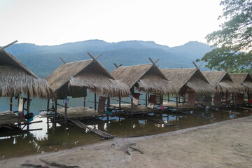 Straw floating huts on the water at Huay Tueng Thao Reservoir in Chiang Mai, Thailand.