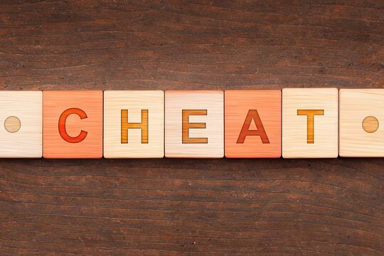 Blocos de letras com a palavra Cheat - Conceito de uso de uma palavra chave em palestra