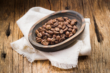 Roasted coffee beans in container, Colombian coffee