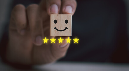 Satisfaction evaluation and service concept, hand-picked wooden block, happy face, five stars