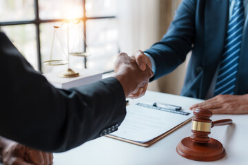 Businessman and lawyer shaking hands, contracting in a mutual agreement, shaking hands to congratulate success.