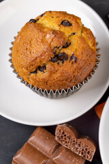 Sweet fresh cupcake with chocolate pieces