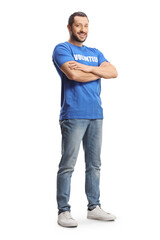 Full length portrait of a young man wearing a blue volunteer t-shirt and posing
