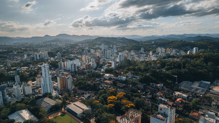 aerial image of downtown Blumenau, with Itajaí Açú River, Santa Catarina, southern Brazil, buildings, main streets, vegetation and sunny day