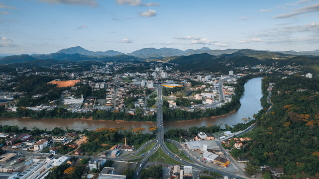 aerial image of downtown Blumenau, with Itajaí Açú River, Santa Catarina, southern Brazil, buildings, main streets, vegetation and sunny day