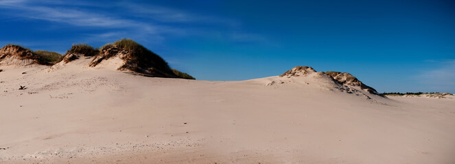 dunes in the desert against the blue sky
