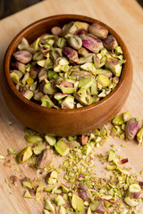 Crispy delicious pistachios with salt on the table