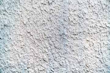 The texture of the wall with cement streaks is painted with light paint