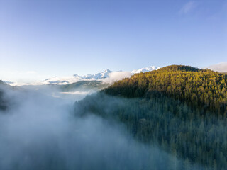 Canadian Mountain Landscape Nature Background. Aerial View. Sunny Winter Sunrise. Near Squamish, BC, Canada.