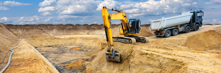 excavator is working and digging at construction site